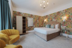 Florence Gardens Boutique Hotel and Restaurant in Portsmouth, image may contain: Corner, Home Decor, Bed, Furniture