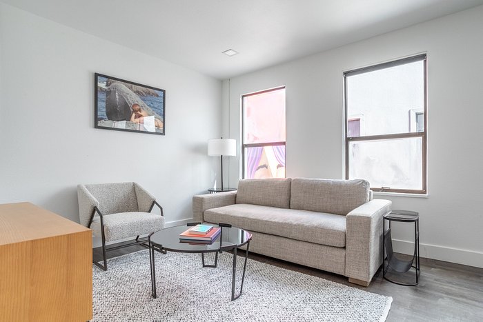 Stained plywood box houses kitchen and bedroom in renovated Seattle condo