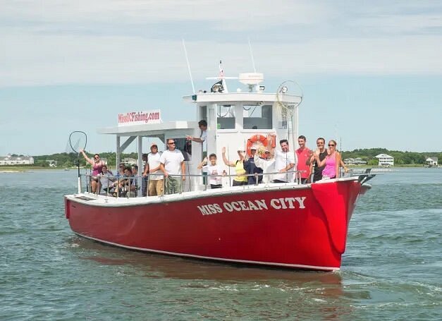 People on red boat with Miss Ocean City written on side