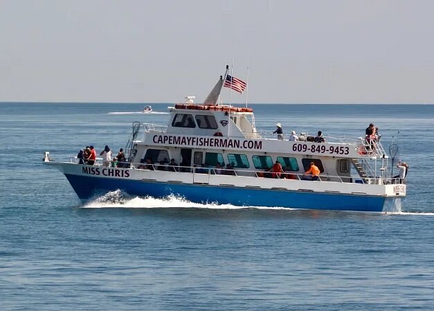 People on Miss Chris boat moving in water