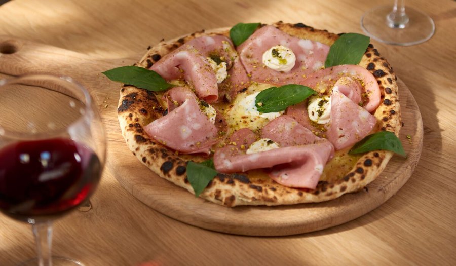 Mortadelle pizza with lemon cream chees and pesto