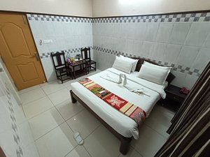 Hotel Arunachala in Pondicherry, image may contain: Chair, Bed, Resort, Hotel