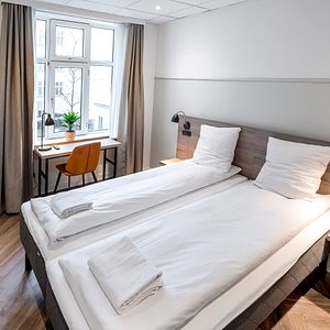 Standard Double Room, 12m2 with a 160x200 double bed, with bathroom en-suite.
The room features free highs speed Fiber WIFI, flatscreen TV, a desk, chair, wardrobe space, luggage rack, mirror.