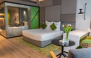 Al Khoory Courtyard Hotel in Dubai, image may contain: Home Decor, Interior Design, Furniture, Bed