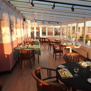 Dine in our bright and airy Conservatory Restaurant overlooking The Bay.