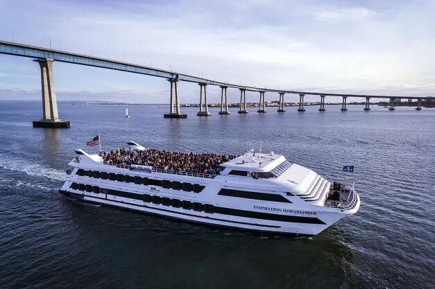 Many people on top deck of boat cruise