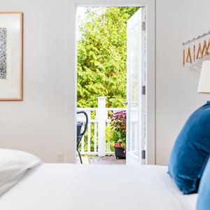 King Guest Room with balcony & private design inspired bathroom.  Guests must inquire directly to reserve this specific guest room, based on availability.  
