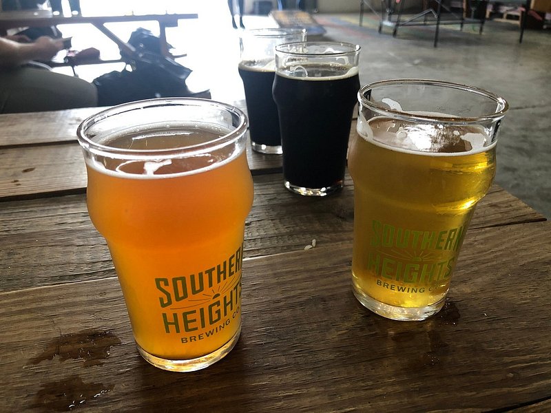 A light beer, amber-colroed beer, and two dark colored beers with with Southern Heights Brewing Co written on the glass