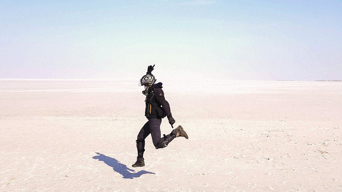 A man jumping on the Kutch salt flats in India