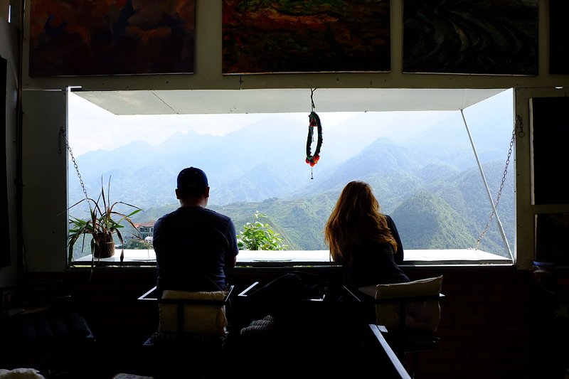 A couple sitting in front of a window in Sapa Vietnam