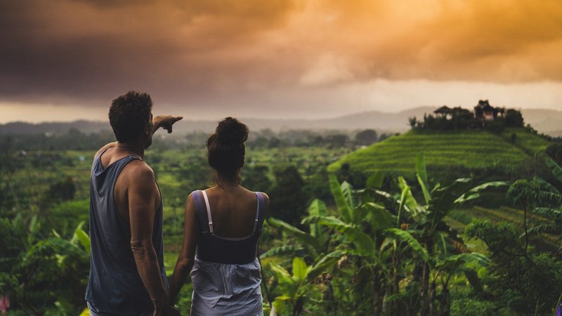 A couple admiring the scenery in Sidemen village, Bali, Indonesiaa