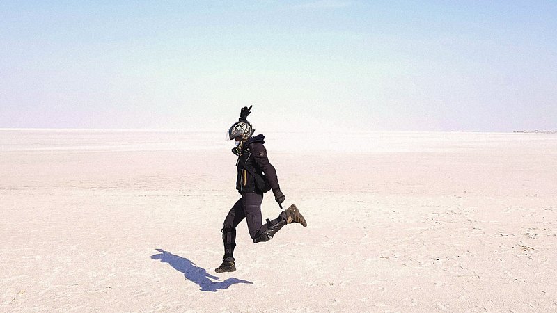 A man jumping on the Great Rann of Kutch salt flat in India
