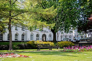 The Queens Hotel in Cheltenham, image may contain: Grass, Park, Outdoors, Bench