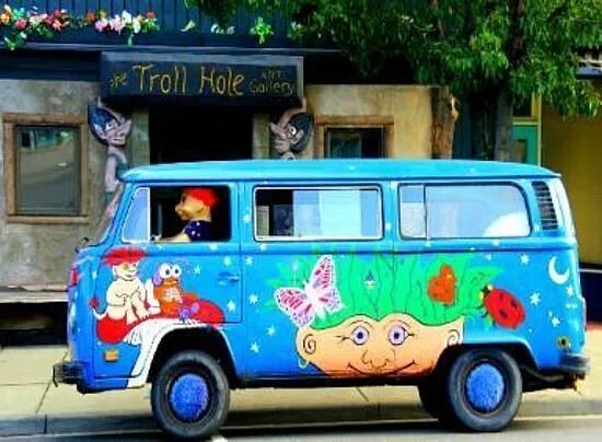 Colorful painted bus outside of The Troll Hole Art Gallery