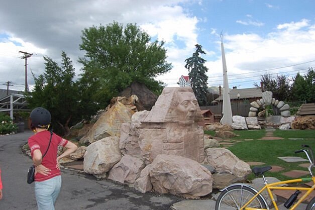 Kid looking at outdoor rock sculpture