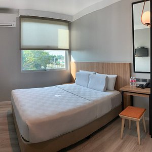 Go Hotels Bacolod in Negros Island, image may contain: Interior Design, Furniture, Bed, Bedroom