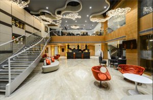 Hotel Atishay in Bhopal, image may contain: Staircase, Housing, Foyer, Indoors