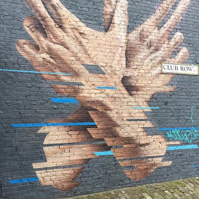 Street art of two hands in Shoreditch