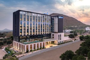 Radisson Blu Hotel & Spa, Nashik in Nashik, image may contain: Office Building, Hotel, City, Convention Center