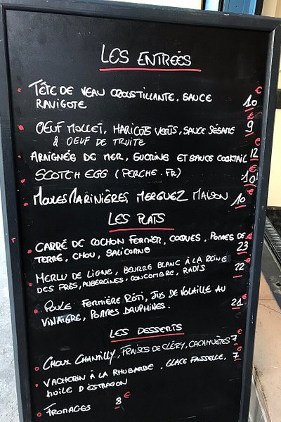 Traditional chalk menu at Le Cadoret bistro in Paris