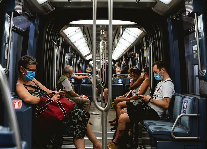 People sitting on the Paris metro train