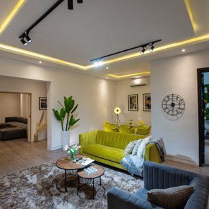 George Residence in Lagos, image may contain: Home Decor, Cushion, Lighting