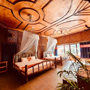 Queen-size bed room for family with great view and a balcony.