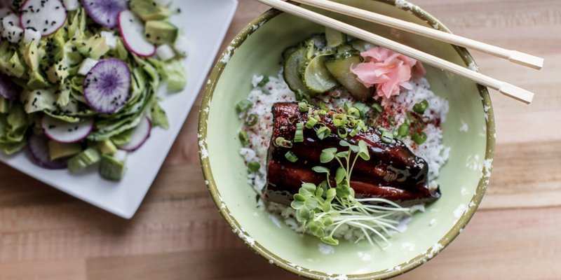 Colorful plate of goddess greens and unagi don