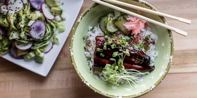 Colorful plate of goddess greens and unagi don