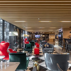 Maxima Domodedovo Airport Hotel in Domodedovo, image may contain: Indoors, Restaurant, Lounge, Furniture