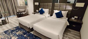 Best Western Plus Tejvivaan in Visakhapatnam, image may contain: Furniture, Home Decor, Hotel, Cushion