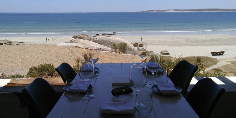 Dinner table set on the beach
