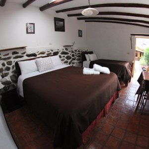 Hostal Iskay in Ollantaytambo, image may contain: Bed, Furniture, Chair, Hotel