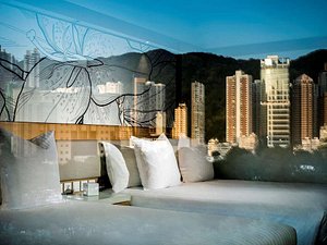 The Park Lane Hong Kong, a Pullman Hotel in Hong Kong, image may contain: City, Cushion, Couch, Condo
