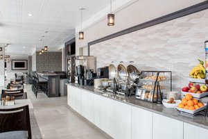 Chateau Moncton Trademark Collection by Wyndham in Moncton, image may contain: Cafeteria, Restaurant, Indoors, Interior Design