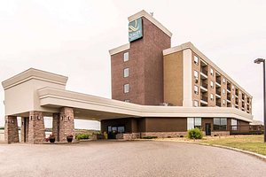 Quality Hotel in Drumheller, image may contain: Clock Tower, Hotel, Inn, City
