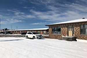 Travelodge by Wyndham Cochrane South in Cochrane, image may contain: Hotel, Car, Pickup Truck, Suburb