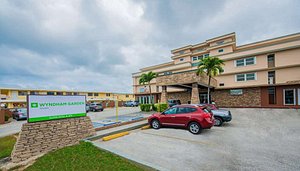 Wyndham Garden Guam in Guam, image may contain: Hotel, Building, Car, Vehicle