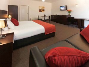 Mercure Port of Echuca in Echuca, image may contain: Screen, Monitor, Table Lamp, Chair