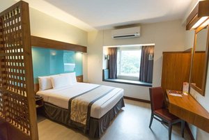 Microtel by Wyndham UP Technohub in Luzon, image may contain: Hotel, Resort, Chair, Furniture