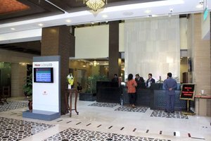Ramada by Wyndham Islamabad in Islamabad, image may contain: Airport, Person, Table, Terminal