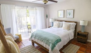 Villa Montana Beach Resort in Puerto Rico, image may contain: Home Decor, Bed, Furniture, Bedroom