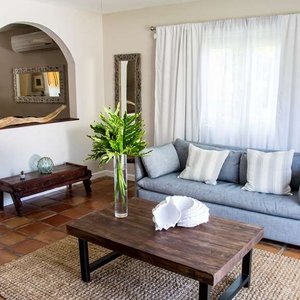 Villa Montana Beach Resort in Puerto Rico, image may contain: Home Decor, Bed, Furniture, Bedroom