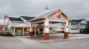 Best Western Plus University Park Inn & Suites in Ames, image may contain: Hotel, Building, Housing, Portico