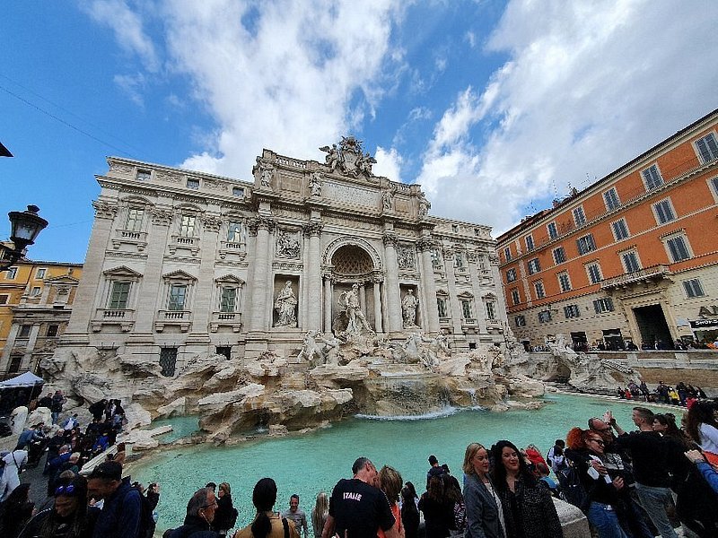 A crowd at the Trevi Fountain in Rome