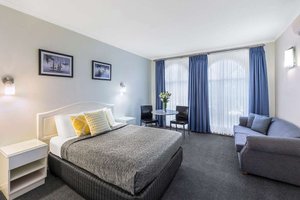 Best Western Cathedral Motor Inn in Bendigo, image may contain: Home Decor, Chair, Furniture, Bed