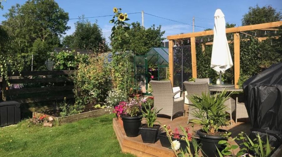 Back garden with decked BBQ area