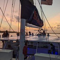 sunset & dolphin catamaran cruise with island time