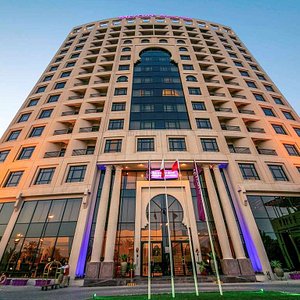 Mercure Grand Hotel Seef in Seef, image may contain: City, Office Building, Urban, High Rise