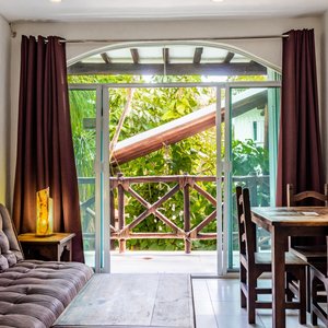 Apart Hotel Casaejido in Playa del Carmen, image may contain: Door, Chair, Housing, Couch